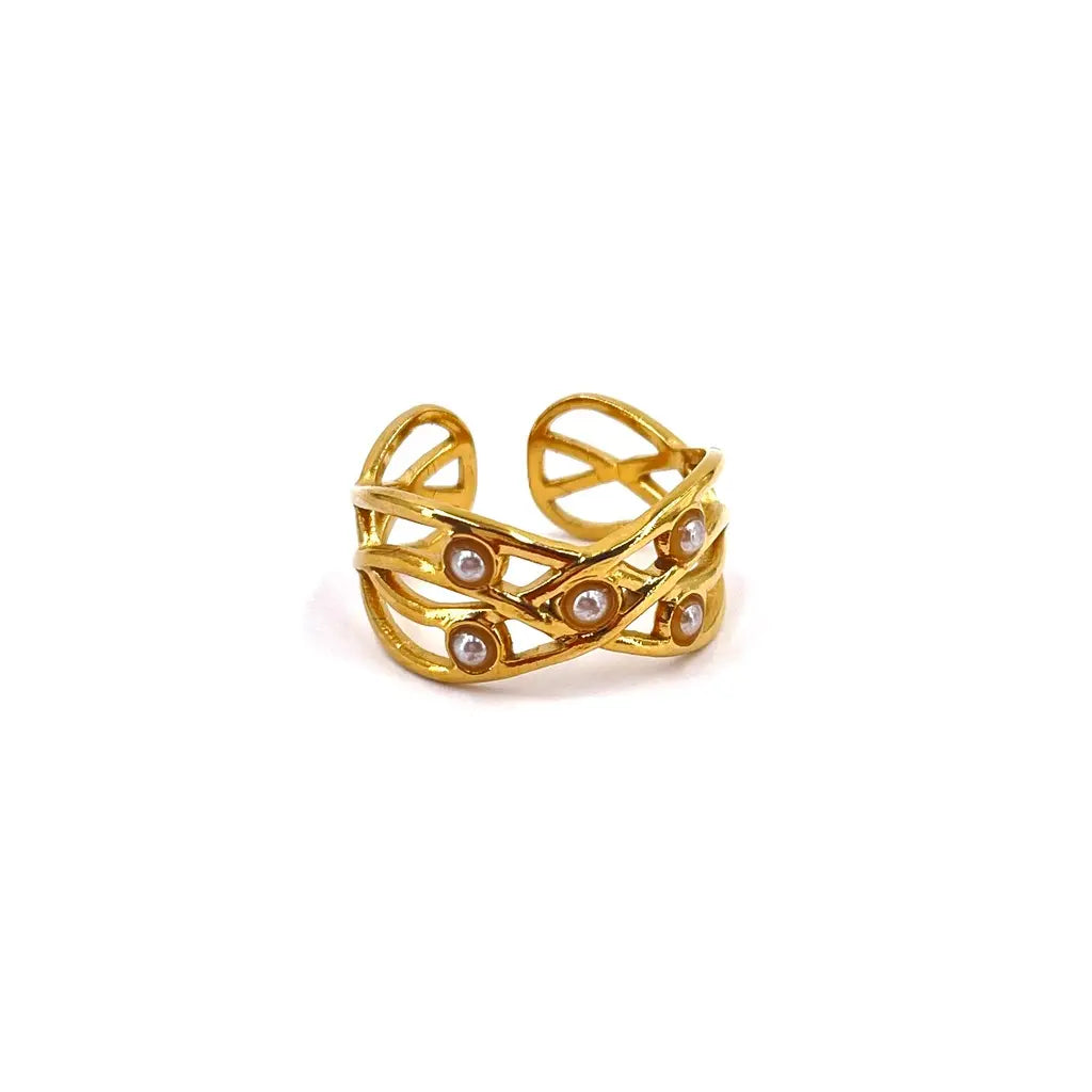 Bague en acier inoxydable aux formes ajourées et ornée de petites boules nacrées