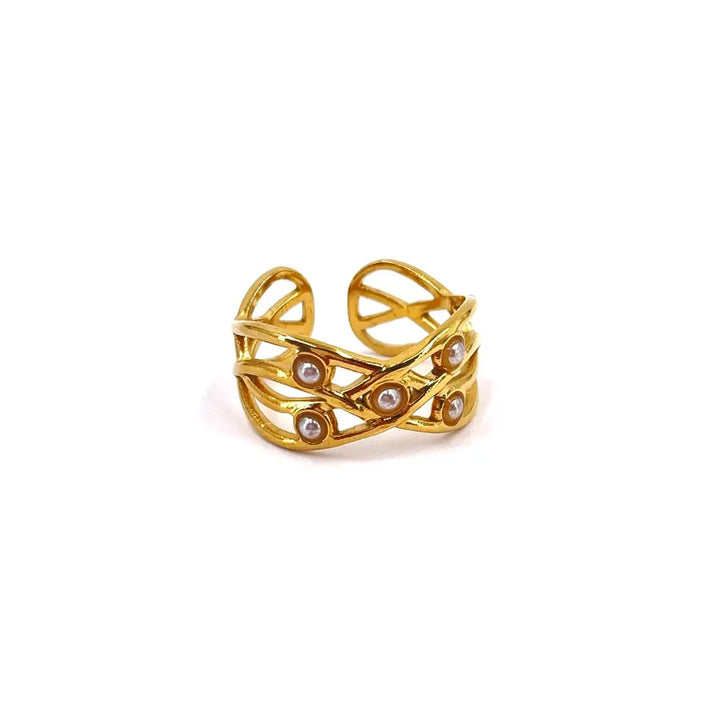 Bague en acier inoxydable aux formes ajourées et ornée de petites boules nacrées