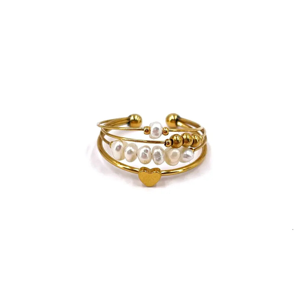 Bague multi rangs en acier inoxydable composée de 4 rangs sertis de perles d’eau douce et d'un cœur